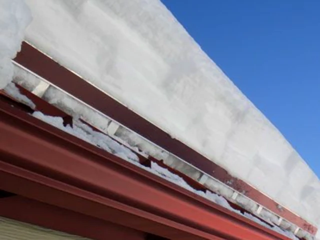 ColorBar screw-down snow rail system on exposed-fastener metal roof